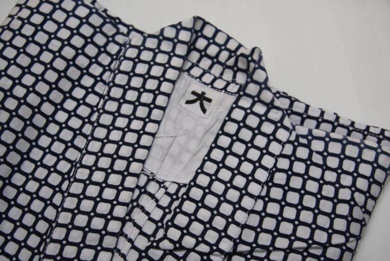 a black and white shirt with a cross on it at Double Black Hotel in Hakuba