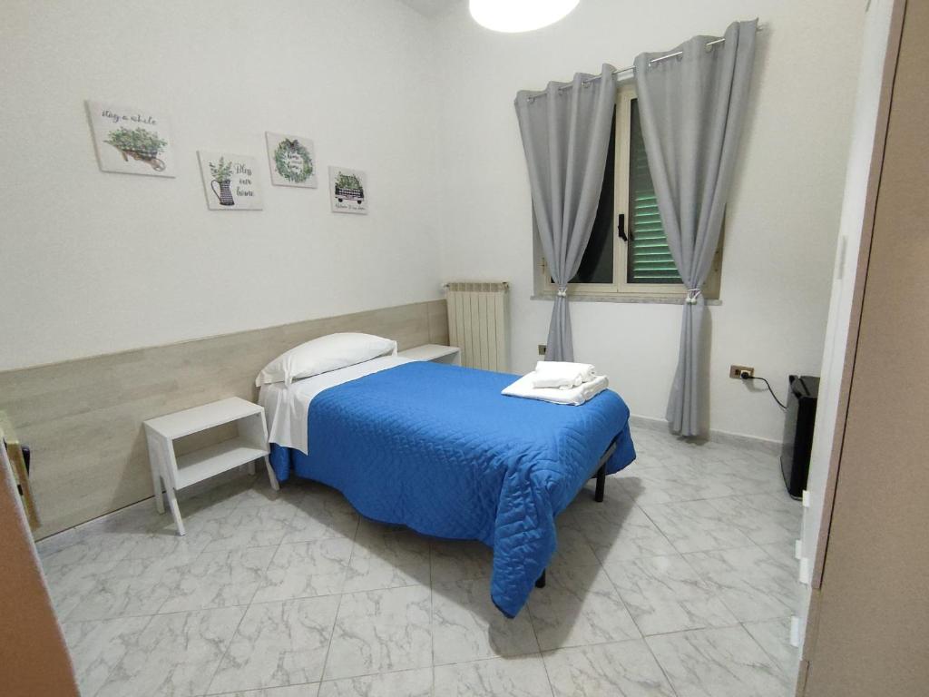 A bed or beds in a room at Il Cortile