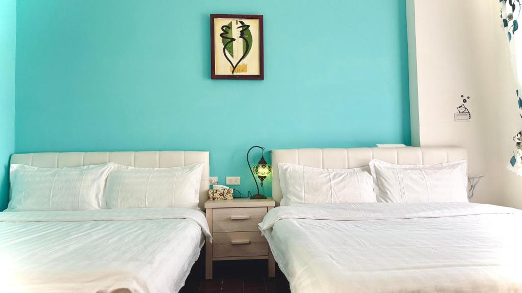 Postel nebo postele na pokoji v ubytování Kinmen 2 Home Puju Homestay