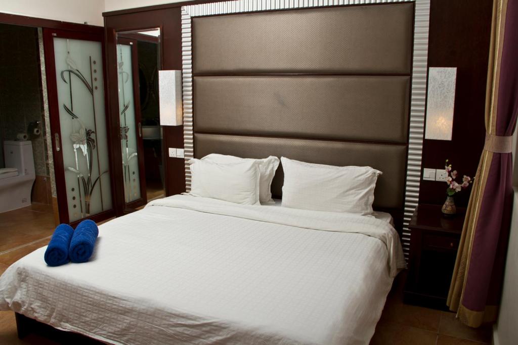 Postel nebo postele na pokoji v ubytování Beringgis Beach Resort & Spa
