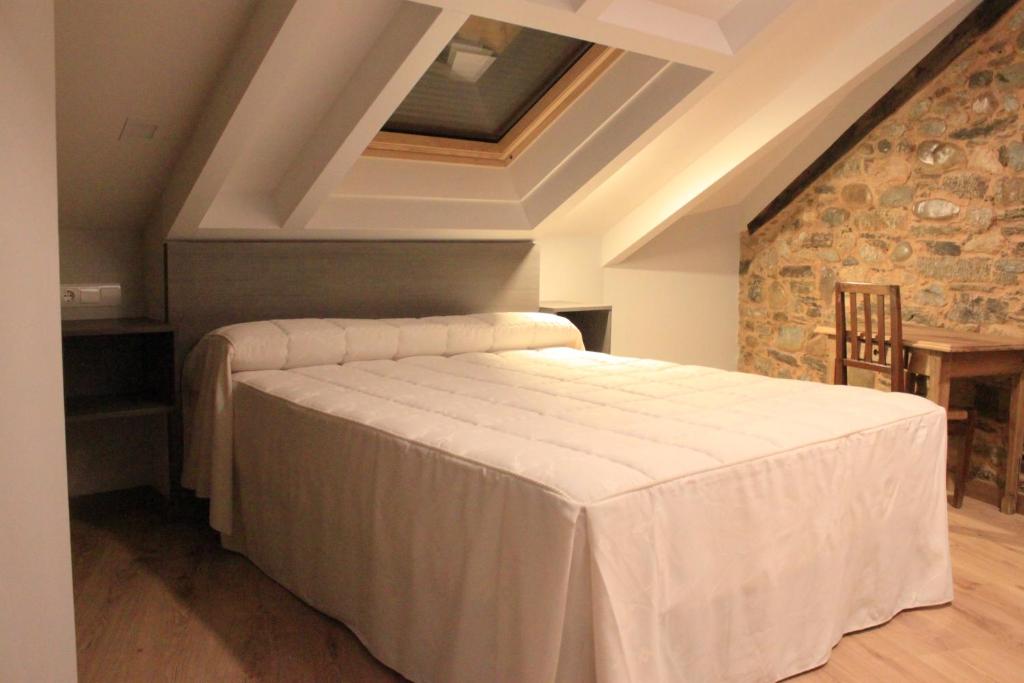 Postel nebo postele na pokoji v ubytování Hostal Siglo XIX