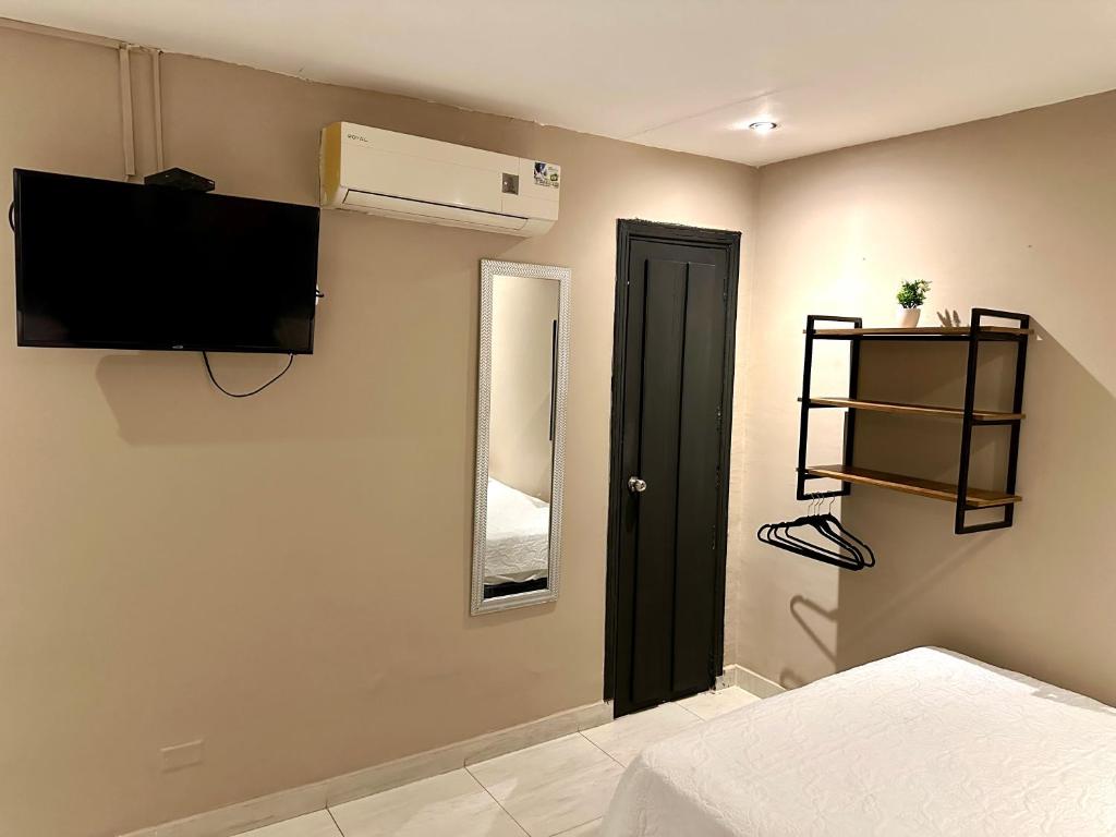 Postel nebo postele na pokoji v ubytování Hotel Londres
