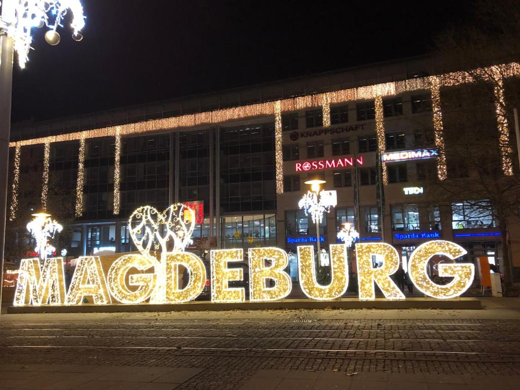 a building with a sign that says macledophone at Elbidyll in Magdeburg