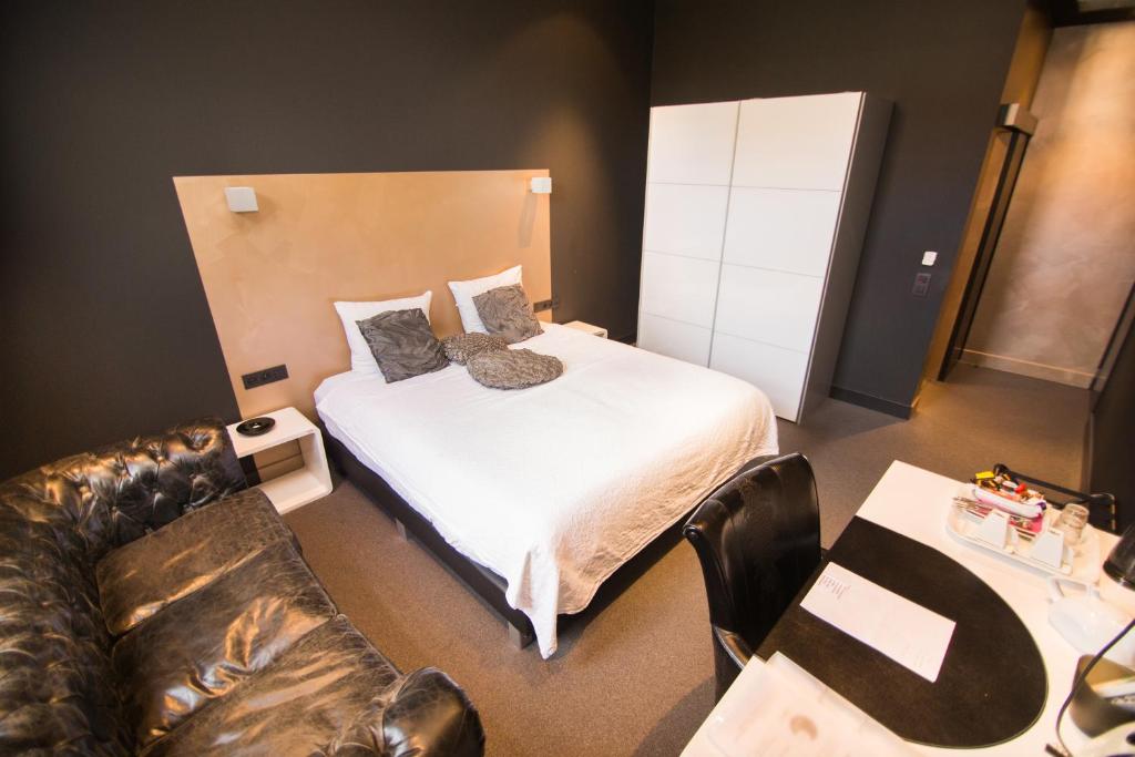 Postel nebo postele na pokoji v ubytování Hotel Moon