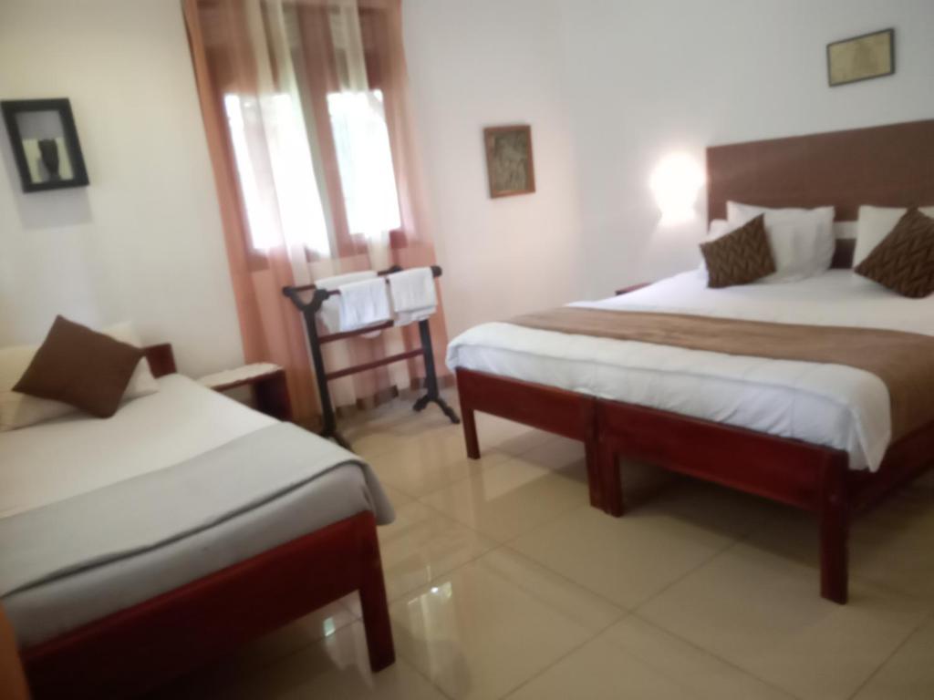 Postel nebo postele na pokoji v ubytování Vidisa Villas