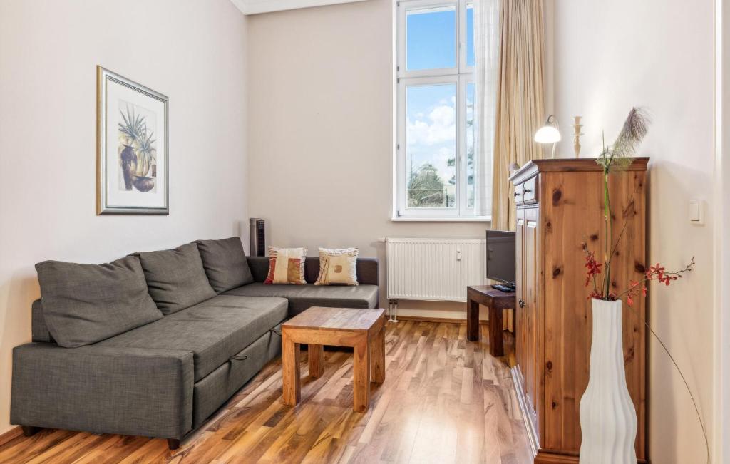 a living room with a couch and a table at 1 Bedroom Stunning Apartment In Anklam in Anklam