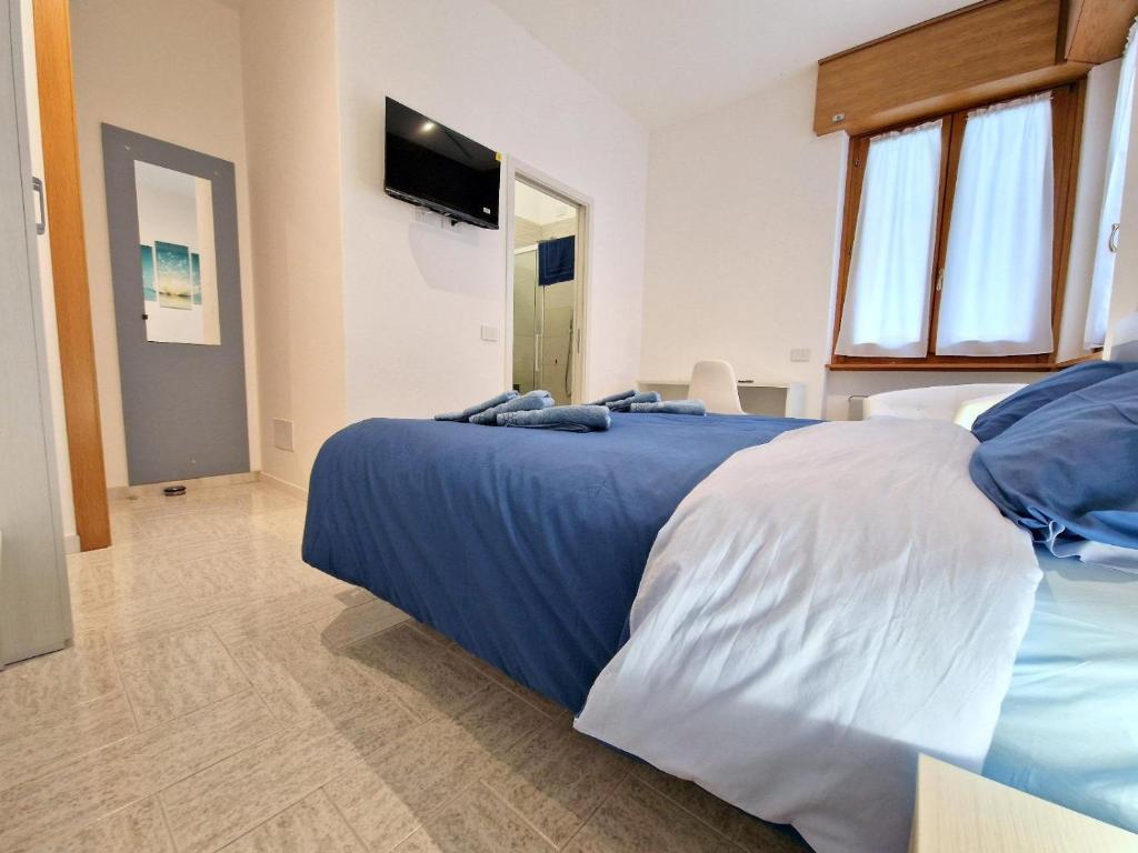 Postel nebo postele na pokoji v ubytování Iris B&B Verona