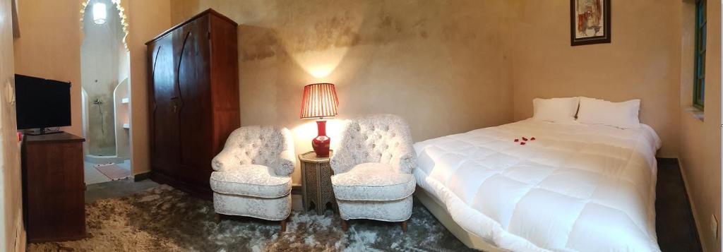 Postel nebo postele na pokoji v ubytování Riad el Medina