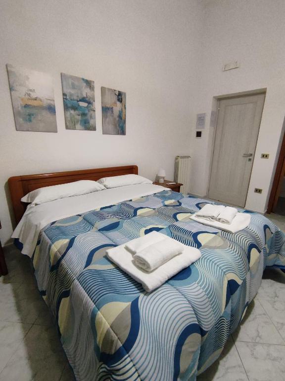 A bed or beds in a room at Il Cortile