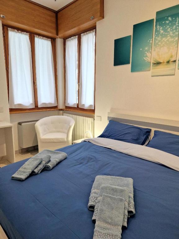 Postel nebo postele na pokoji v ubytování Iris B&B Verona