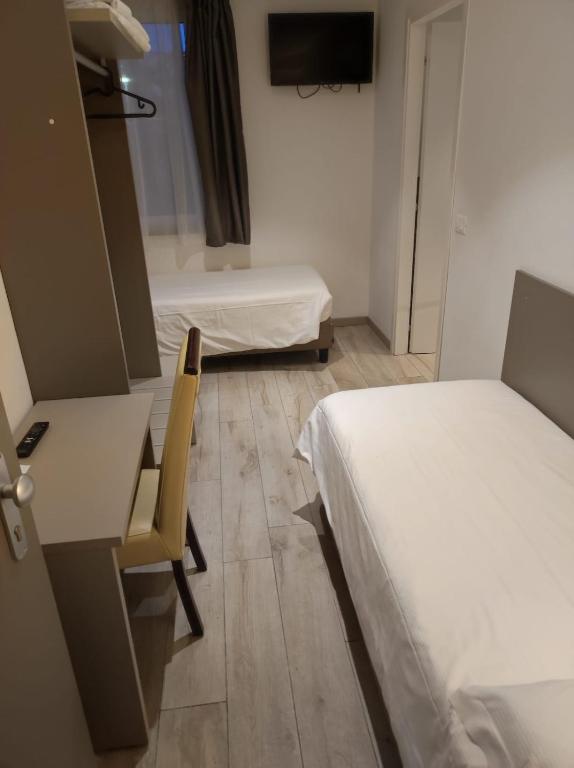 Postel nebo postele na pokoji v ubytování Hotel Sonia