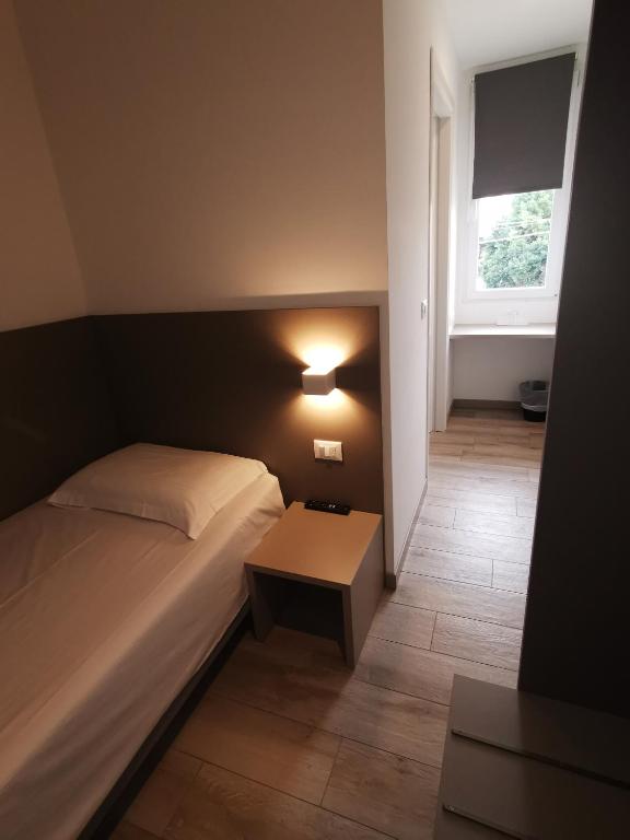 Postel nebo postele na pokoji v ubytování Hotel Sonia