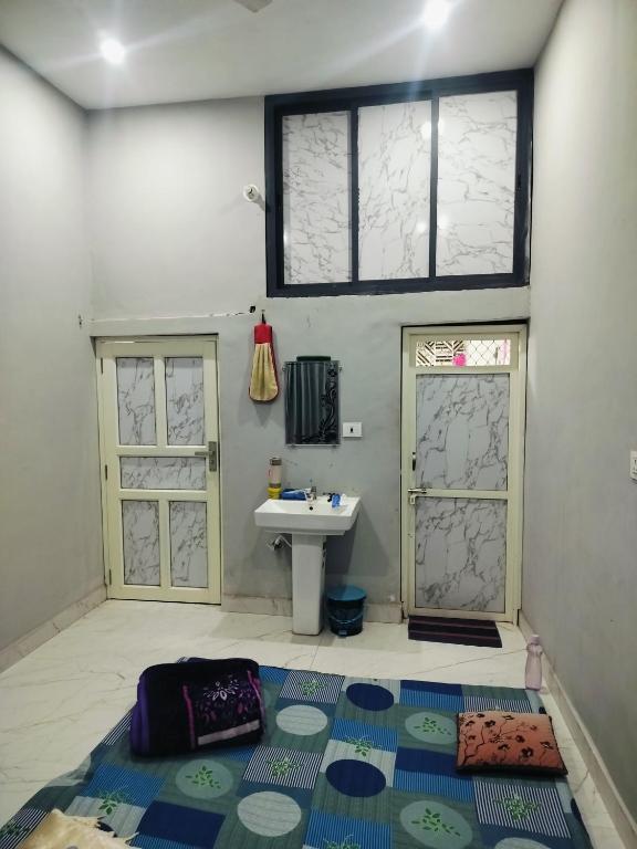 a bathroom with a sink and a sink at Annpurna Apartment in Varanasi