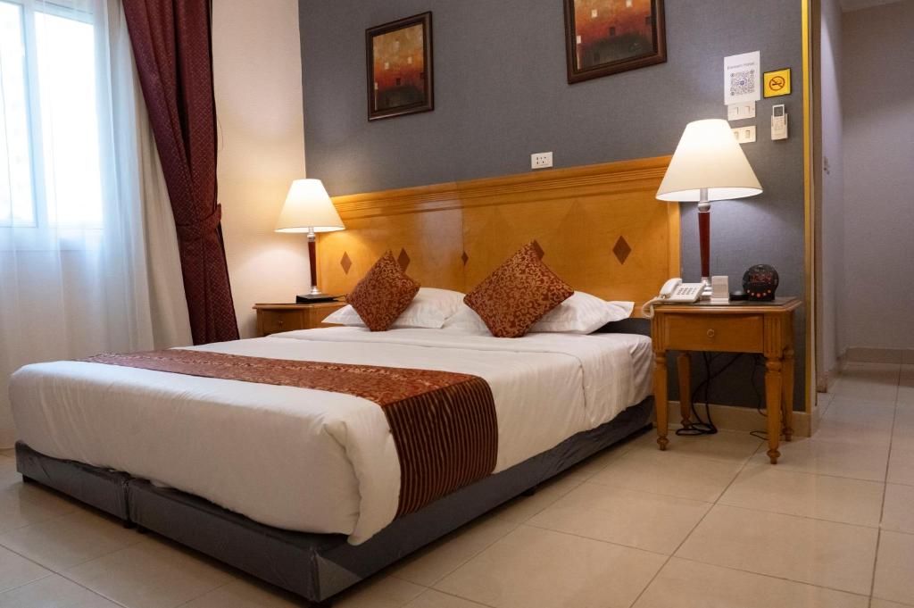 Postel nebo postele na pokoji v ubytování فندق المروج كريم AlMorooj Kareem Hotel