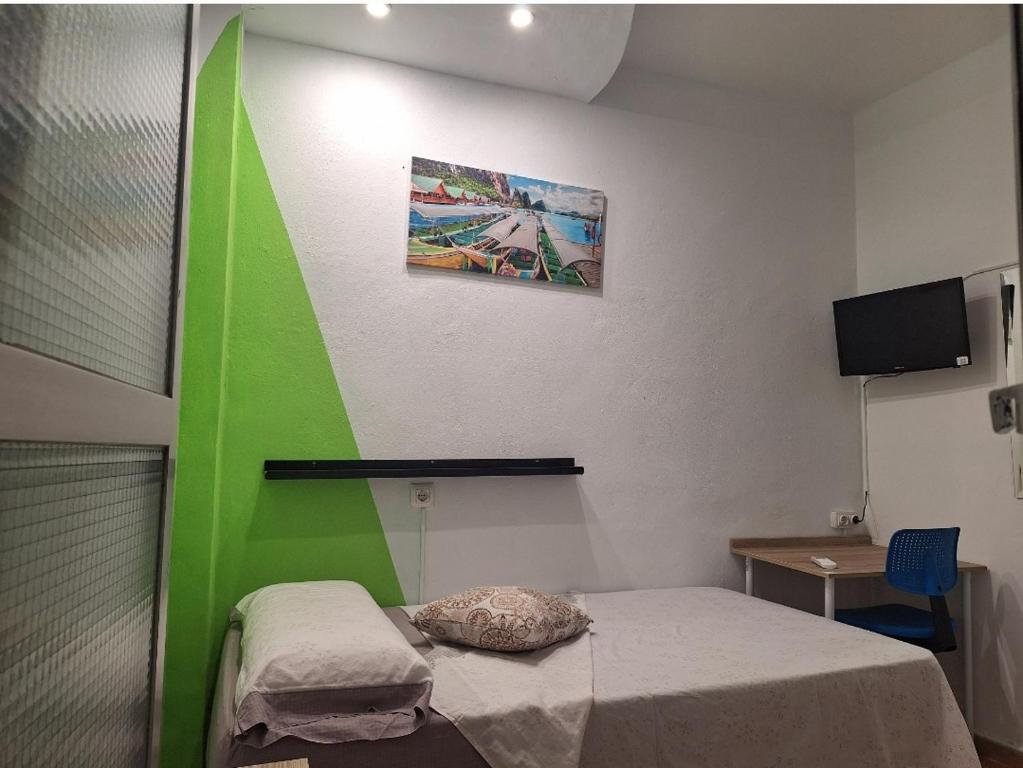 Televízia a/alebo spoločenská miestnosť v ubytovaní Ikigai House