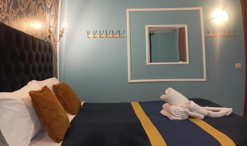 Postel nebo postele na pokoji v ubytování Hotel magnolia 1000 mt dal casello