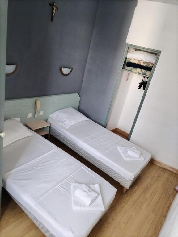 Postel nebo postele na pokoji v ubytování Hotel Saint Jean Baptiste