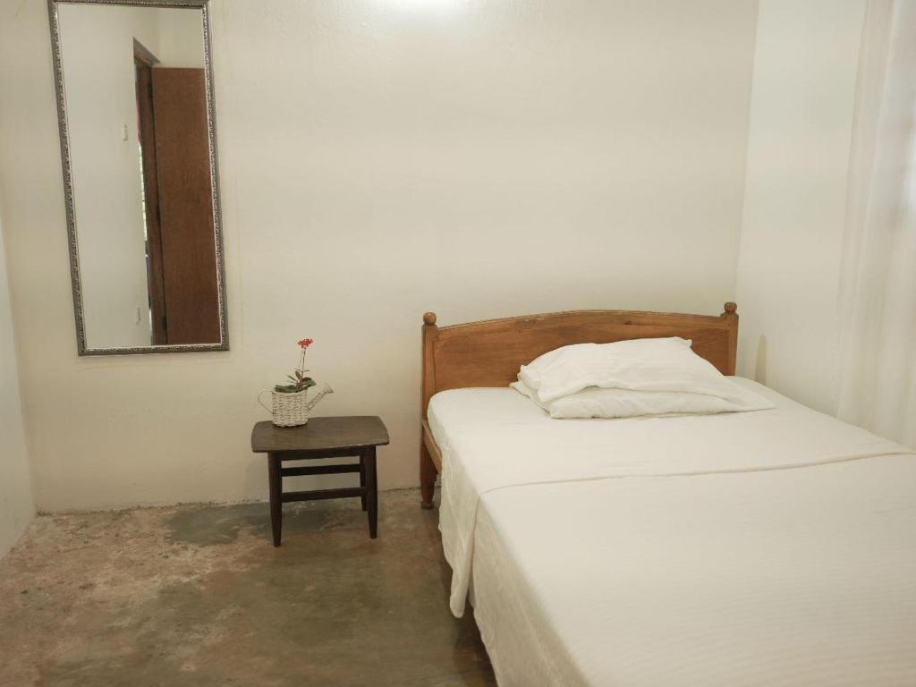 Postel nebo postele na pokoji v ubytování Amma's Homestay
