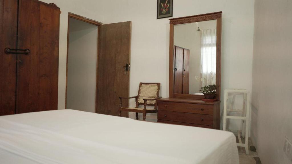 Postel nebo postele na pokoji v ubytování Amma's Homestay