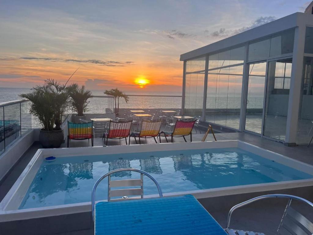 a swimming pool with a view of the ocean at HS-DD Habitación Deluxe cerca al mar con piscina y wifi in Cartagena de Indias