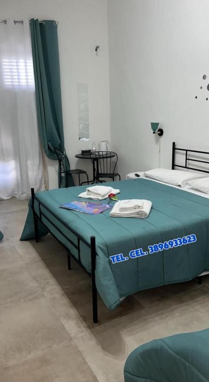 Postel nebo postele na pokoji v ubytování Falaride suite Agrigento discesa sulla valle di oro