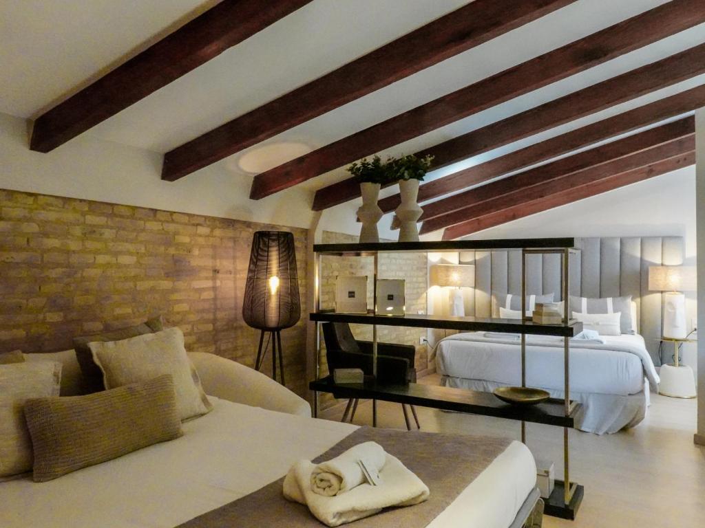 Postel nebo postele na pokoji v ubytování Torres de Serranos Apartments - TTdSSa VLC
