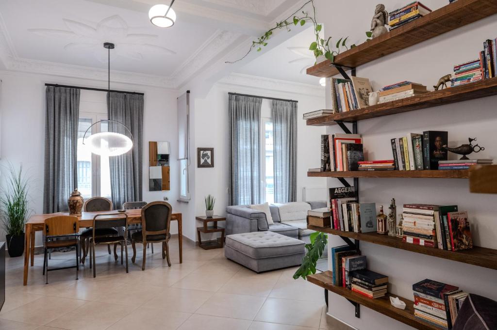 a living room with a table and a dining room at Culturalles 2Bd APT in Thessaloniki