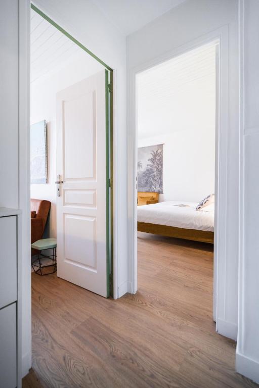 Postel nebo postele na pokoji v ubytování Hôtel Maison Doron