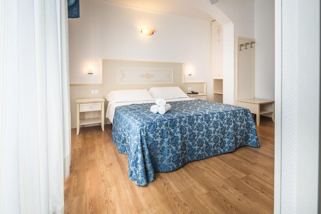 Postel nebo postele na pokoji v ubytování Hotel Principe