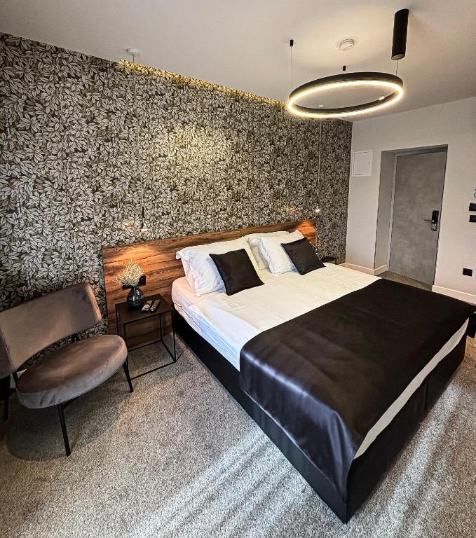 Postel nebo postele na pokoji v ubytování Calma Luxury Rooms