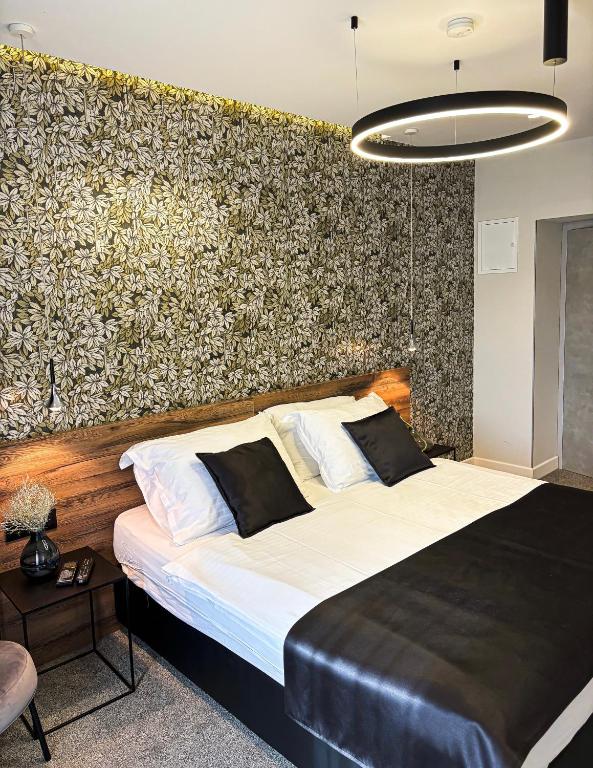 Postel nebo postele na pokoji v ubytování Calma Luxury Rooms