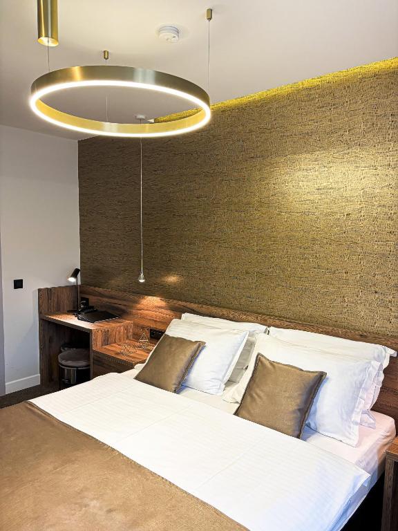 Postel nebo postele na pokoji v ubytování Calma Luxury Rooms