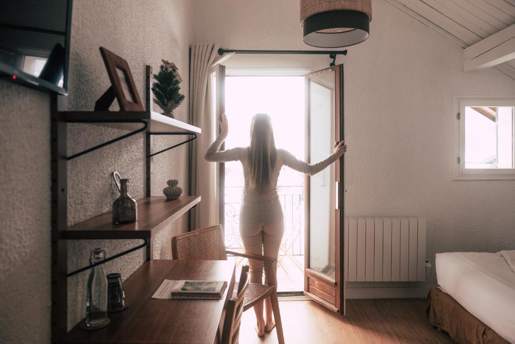 Postel nebo postele na pokoji v ubytování Hôtel Maison Doron