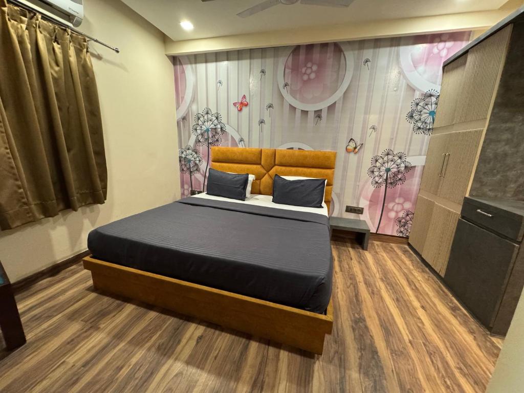 Postel nebo postele na pokoji v ubytování Hotel Sanskriti T And M Hotels