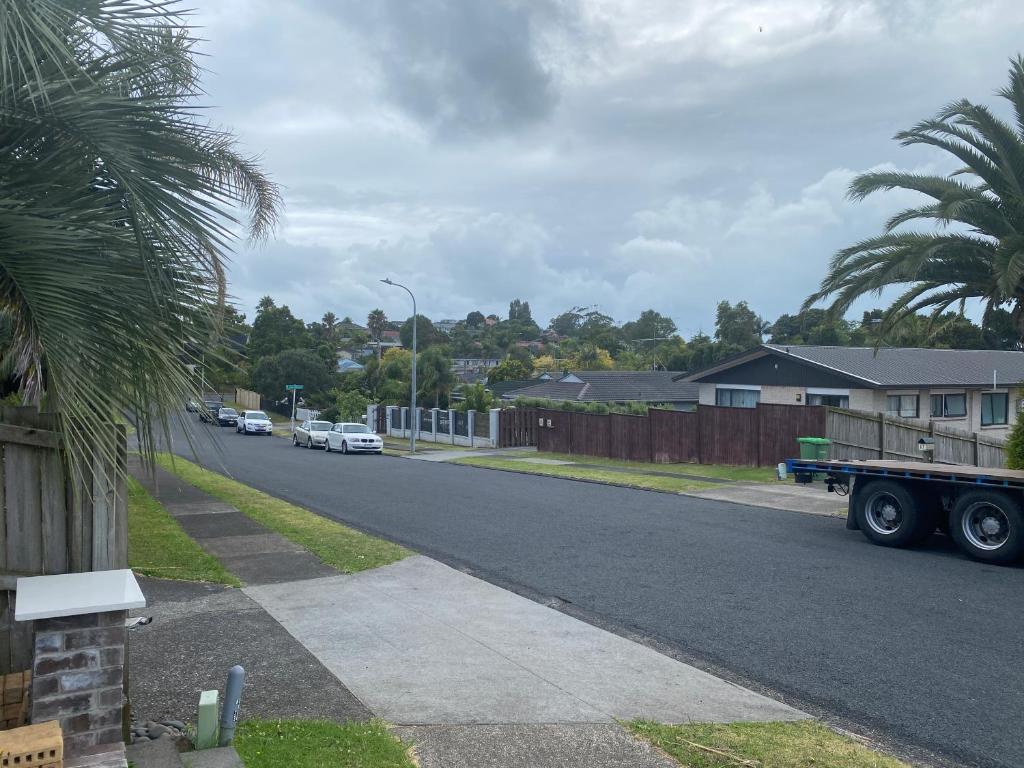 a truck parked on the side of a street at Guesthouse in Half Moon Bay in Auckland