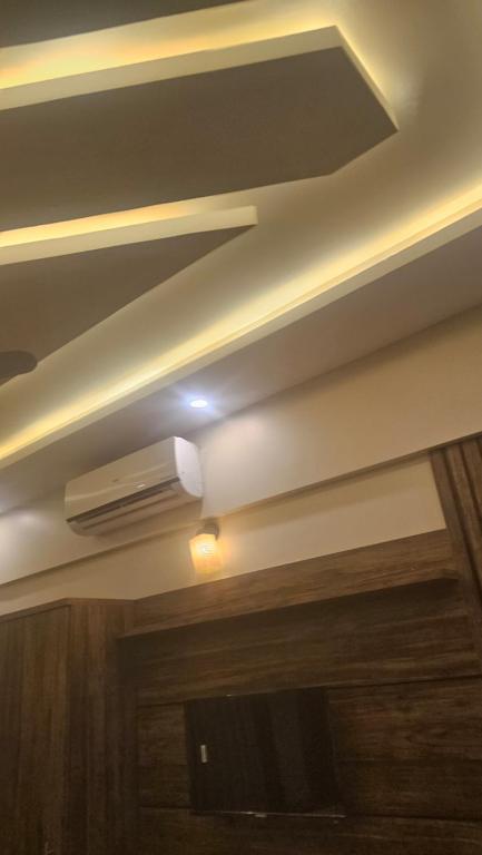 a ceiling with a air conditioner in a room at Hotel Family Guest House in Karachi
