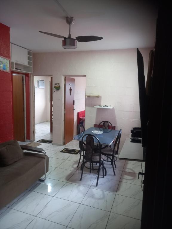 a living room with a table and a couch at Pousada Victor - Arte in Manaus