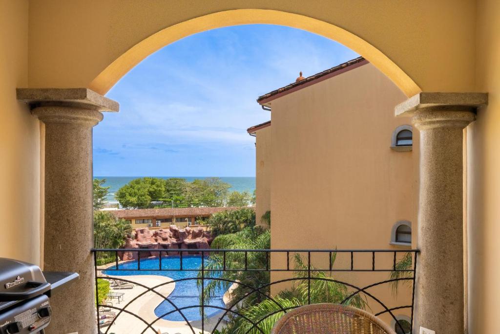 a view from the balcony of a villa at Sunrise 27- 2 Bedroom Ocean View Condo in Tamarindo