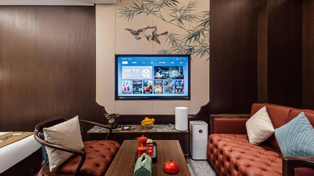 TV a/nebo společenská místnost v ubytování Shanxi Merchant Mansion