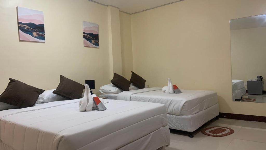 Postel nebo postele na pokoji v ubytování D-Travelers Inn