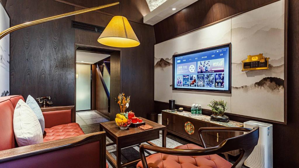 TV a/nebo společenská místnost v ubytování Shanxi Merchant Mansion