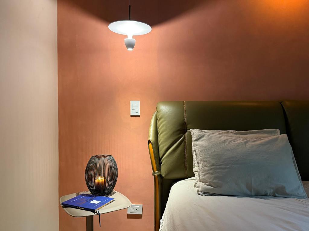 Postel nebo postele na pokoji v ubytování Autenthico Provenza Hotel Medellin