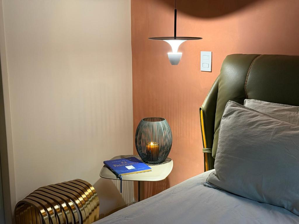 Postel nebo postele na pokoji v ubytování Autenthico Provenza Hotel Medellin