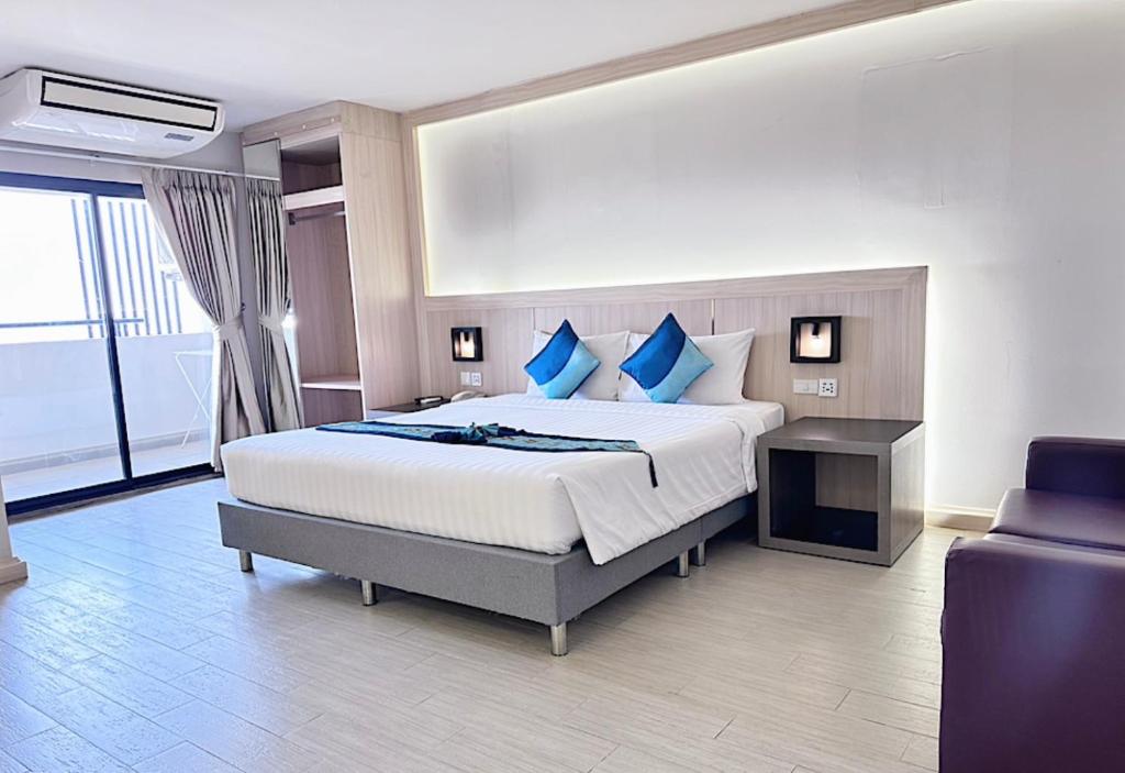 Postel nebo postele na pokoji v ubytování O2 Luxury Hotel