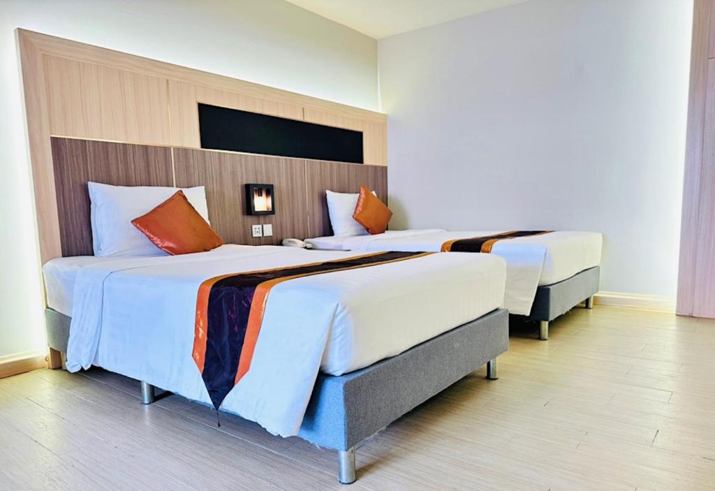 Postel nebo postele na pokoji v ubytování O2 Luxury Hotel