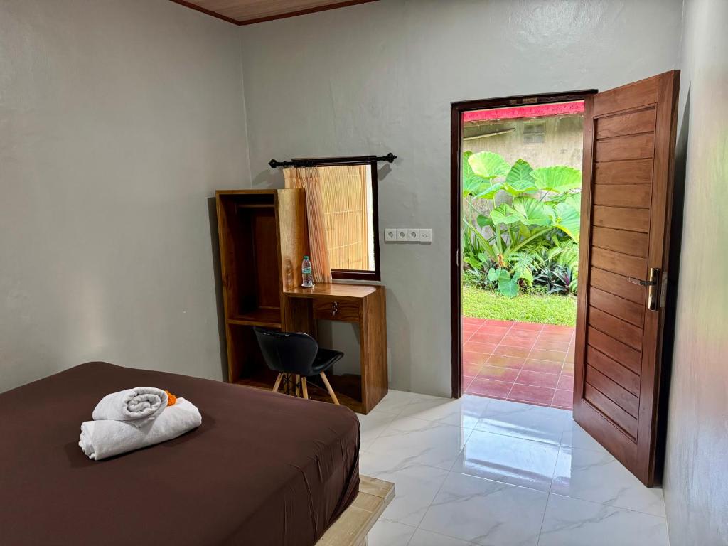 Postel nebo postele na pokoji v ubytování Sari Bungalows