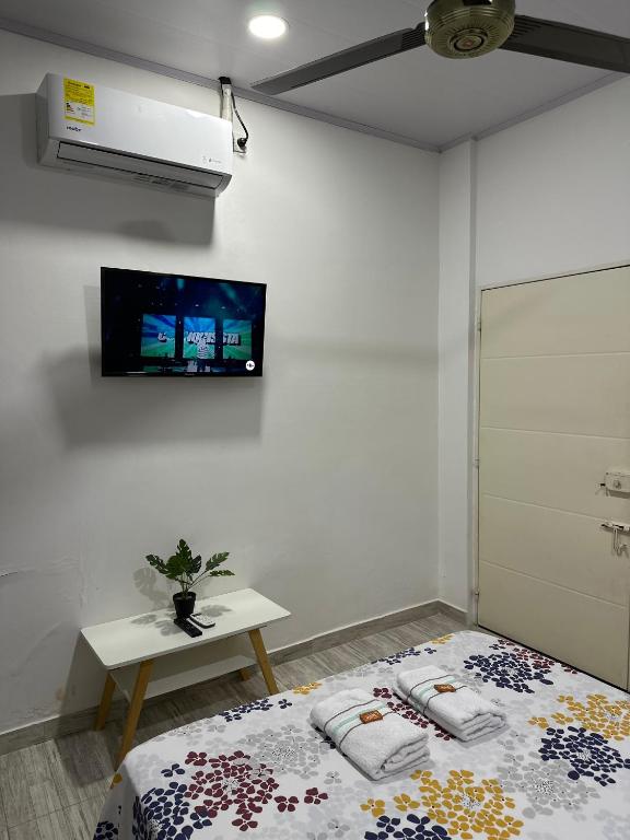 Giường trong phòng chung tại Como en casa