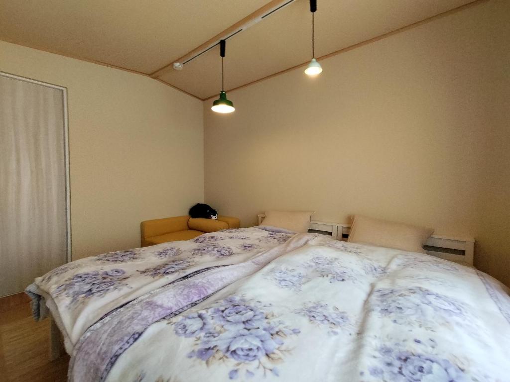 Postel nebo postele na pokoji v ubytování aouei