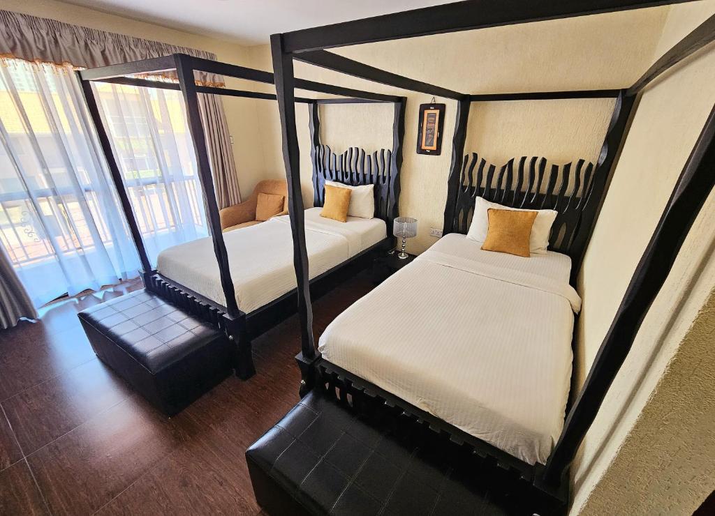 Postel nebo postele na pokoji v ubytování Progressive Park Hotel