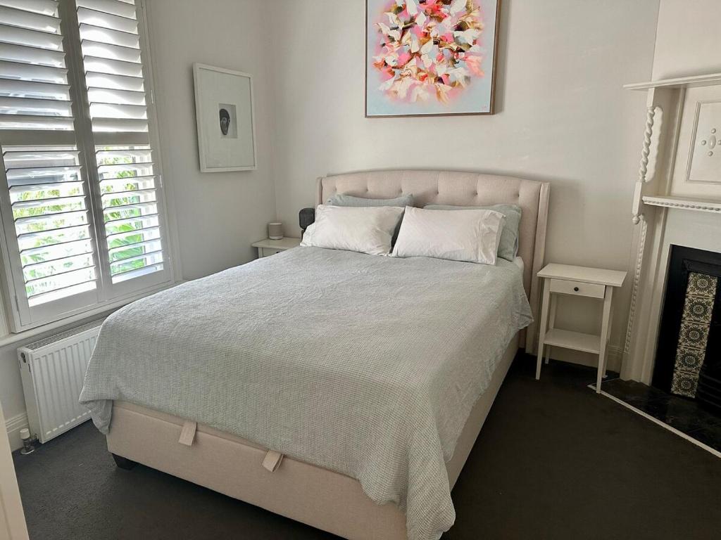 Ένα ή περισσότερα κρεβάτια σε δωμάτιο στο Grand Prix Convenience Middle Park